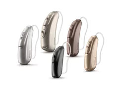 Modern hearing aid devices shown in different finishes and styles.
