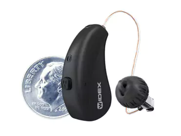 Compact Widex behind-the-ear hearing aid with receiver and ear tip.