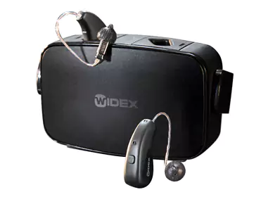 Rechargeable Widex hearing aids with compact charger.