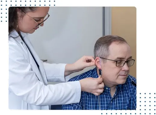 Audiologist performing Real Ear Measurement for personalized hearing aid fitting in Atlanta