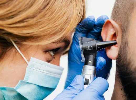 Patient undergoing gentle ear cleaning treatment to improve hearing clarity