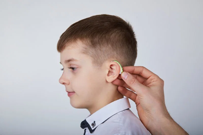 Patient undergoing hearing aid fitting with Real Ear Measurement