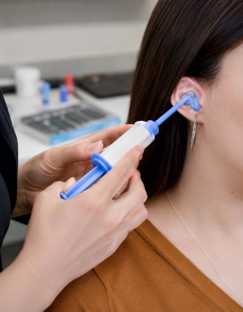Custom ear plug impression procedure performed by an audiologist